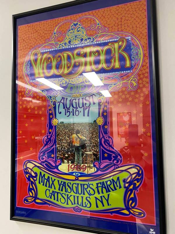 A Woodstock poster is shown at The 1960 bar at Allegiant Stadium on Thursday, April 29, 2021. ( ...