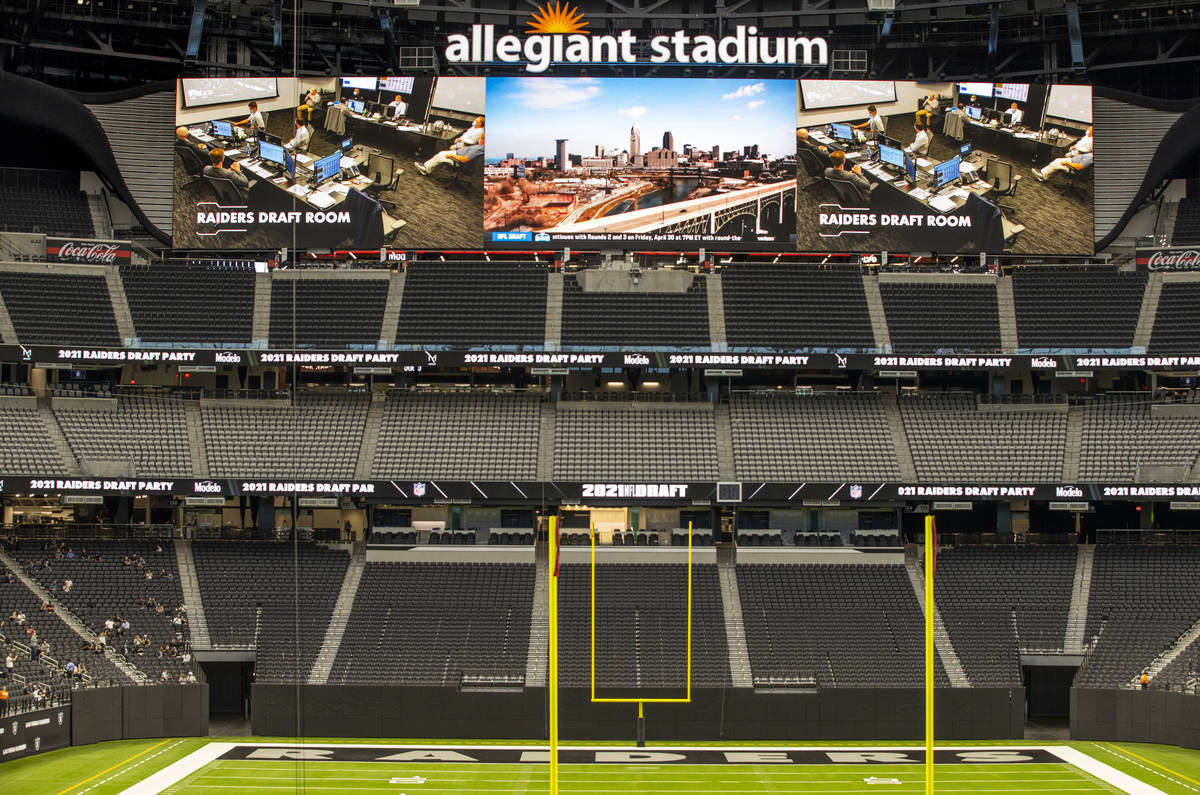 The Raiders draft room is broadcast on the big screen during the 2021 Las Vegas Raiders NFL Dra ...