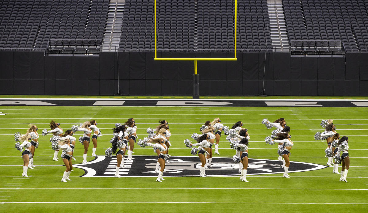 The Raiderettes perform on the field before fans spread throughout the stands during the 2021 L ...