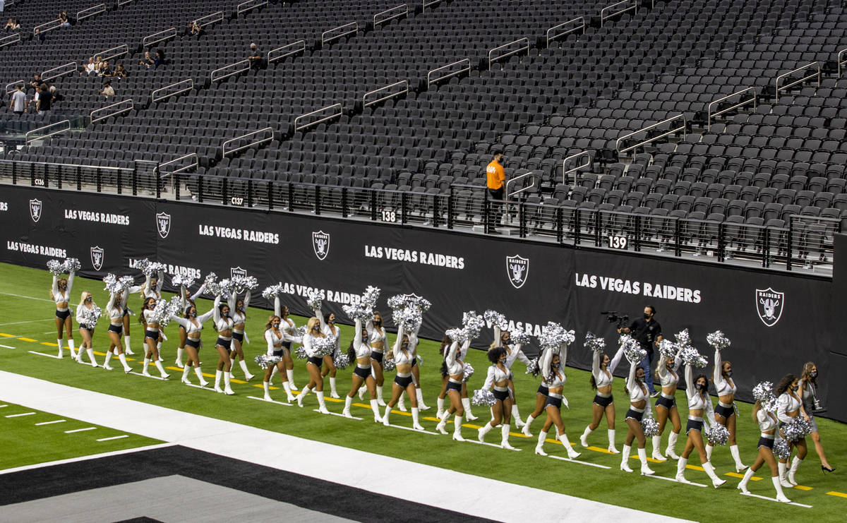 The Raiderettes leave the field before fans spread throughout the stands during the 2021 Las Ve ...