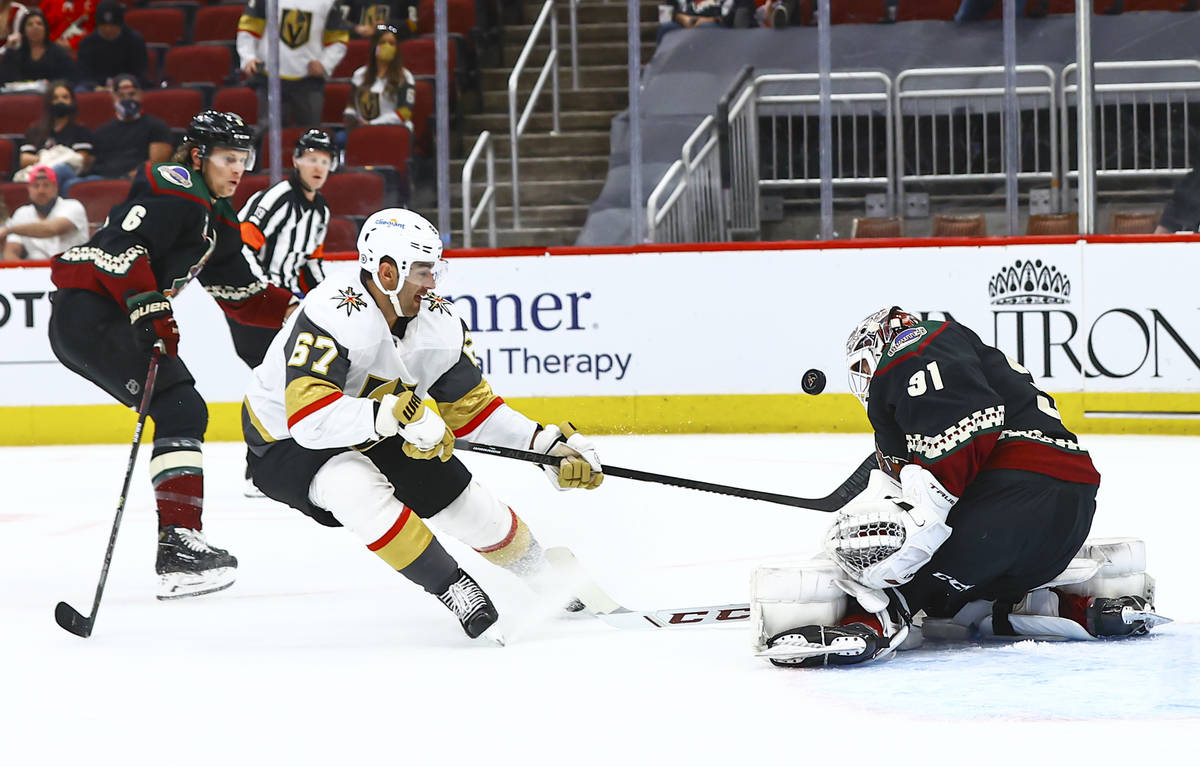 Arizona Coyotes goaltender Adin Hill (31) blocks a shot from Golden Knights' Max Pacioretty (67 ...