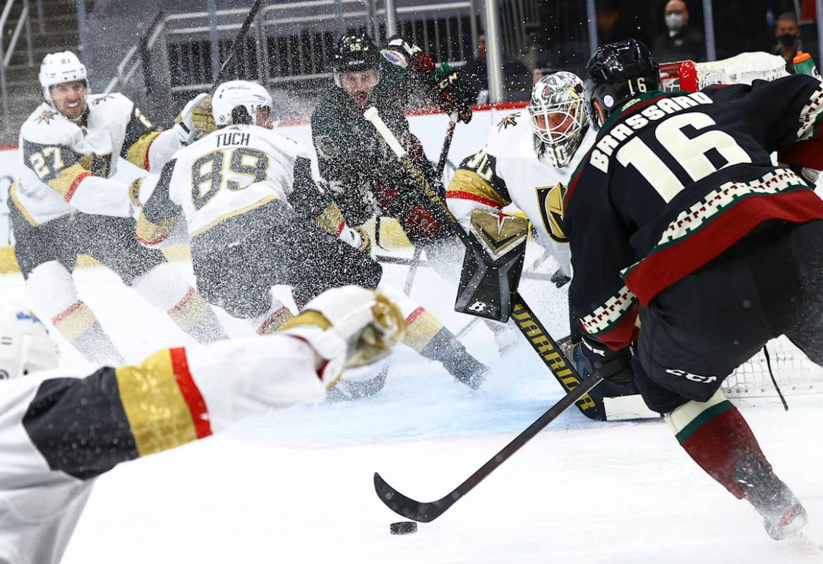 Golden Knights goaltender Robin Lehner (90) defends the net as Arizona Coyotes' Derick Brassard ...