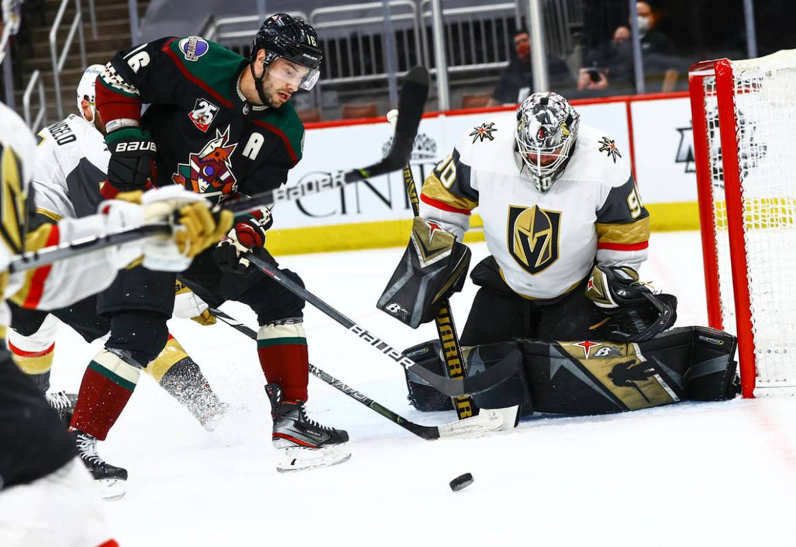 Golden Knights goaltender Robin Lehner (90) blocks the puck as Arizona Coyotes' Derick Brassard ...