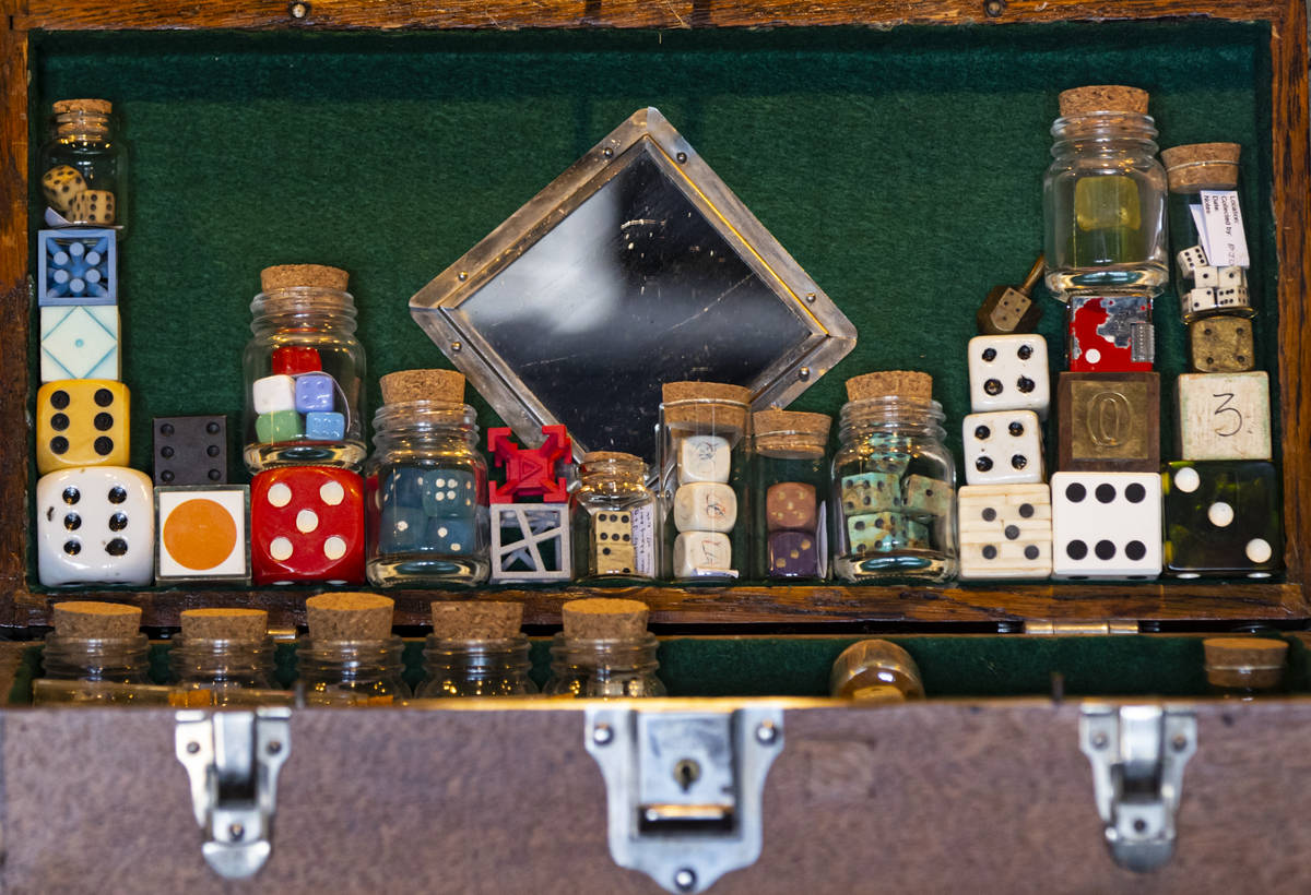 A collection of damaged and altered dice is displayed at the Office of Collecting & Design, ...