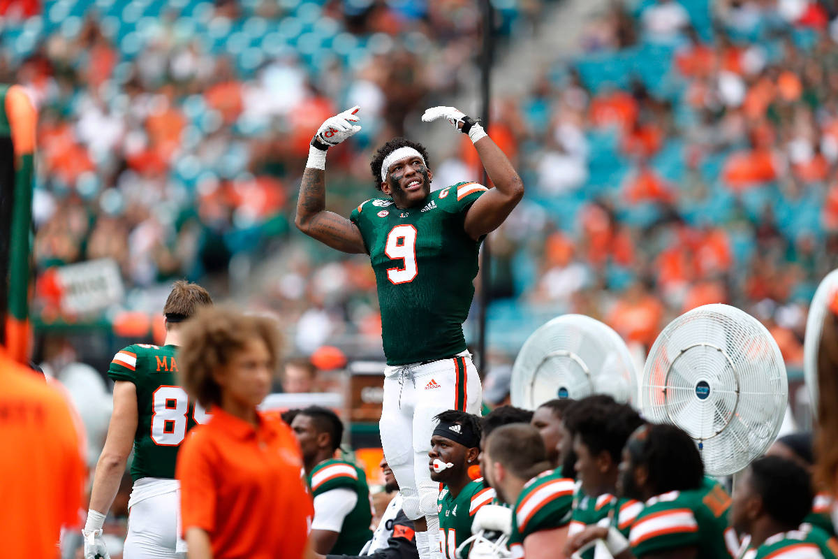 Miami tight end Brevin Jordan (9) encourages the crowd to cheer during the first half of an NCA ...