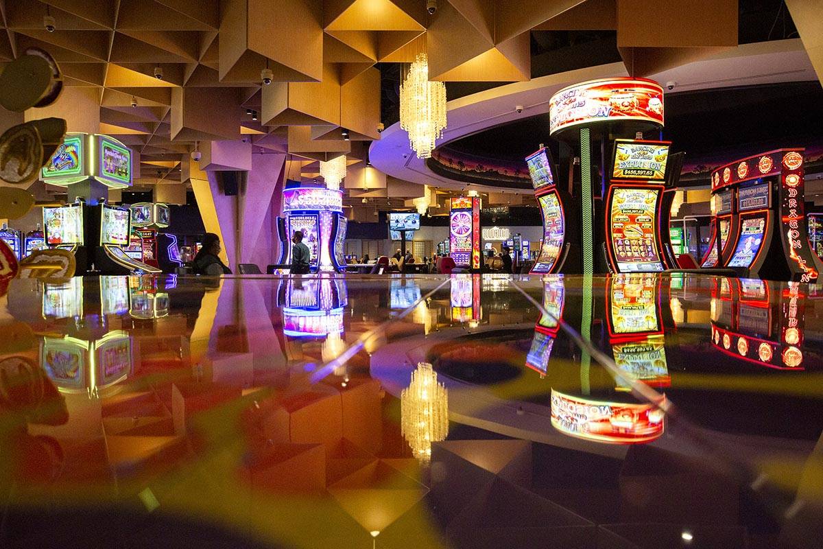 The Mohegan Sun Casino floor is reflected in the top of a piano at Virgin Hotels Las Vegas on F ...