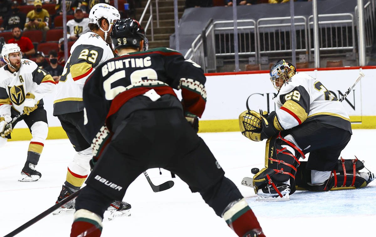 Golden Knights goaltender Marc-Andre Fleury (29) blocks a shot from the Arizona Coyotes during ...