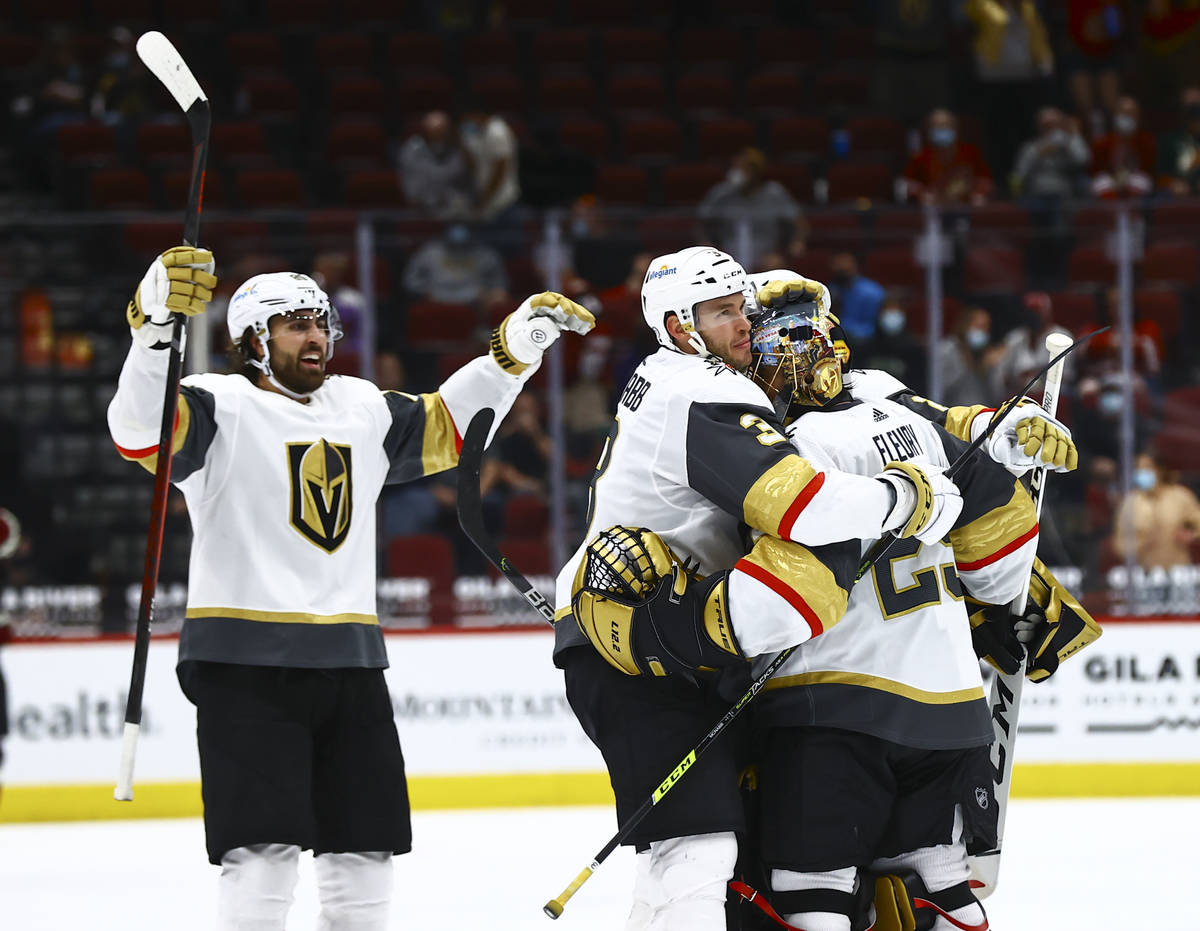 The Golden Knights celebrate with goaltender Marc-Andre Fleury (29) after an overtime win again ...