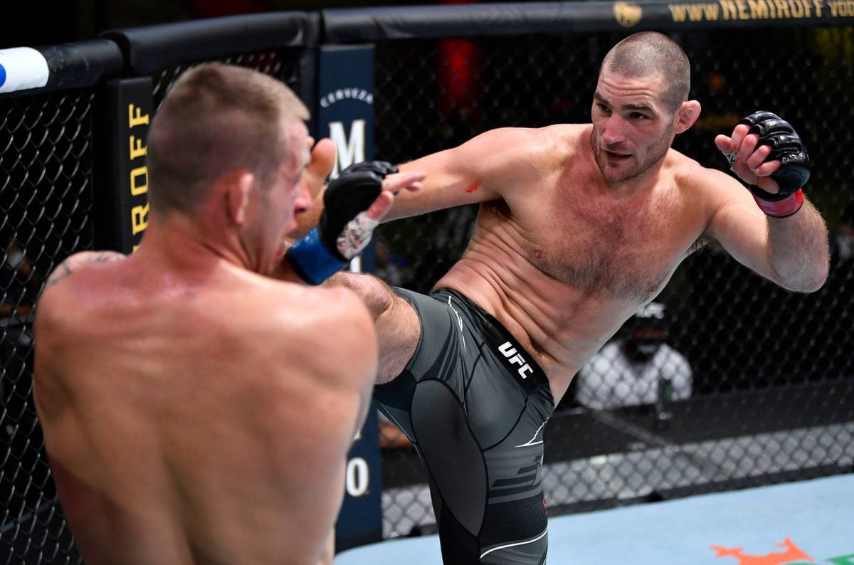 Sean Strickland kicks Krzysztof Jotko of Poland in a middleweight bout during the UFC Fight Nig ...