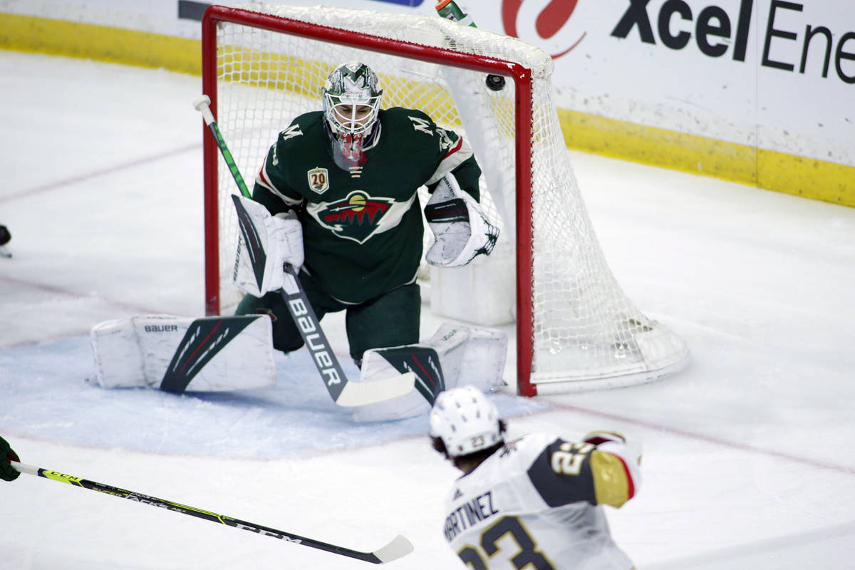 Vegas Golden Knights defenseman Alec Martinez (23) scores a goal against Minnesota Wild goalten ...