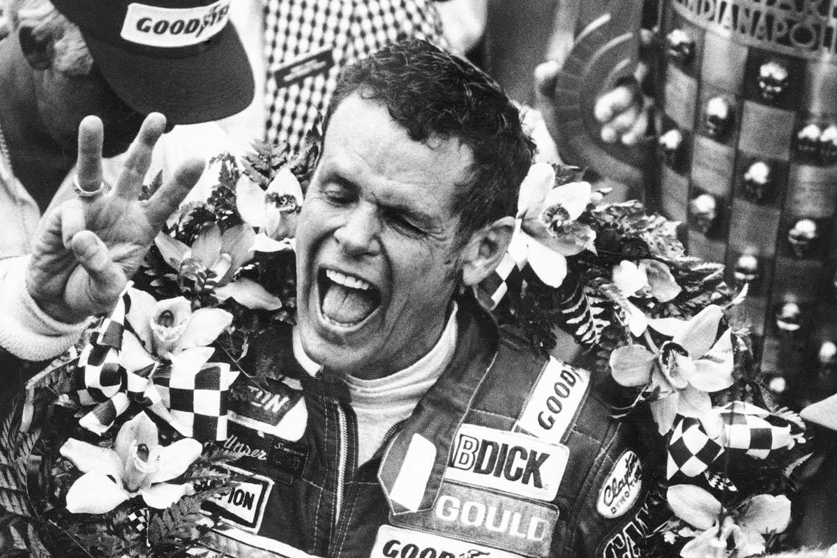 In this May 24, 1981, file photo, Bobby Unser holds three fingers aloft after winning his third ...