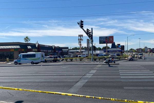 Police investigate a crash involving a bus and a pedestrian Tuesday, May 4, 2021, at the inters ...