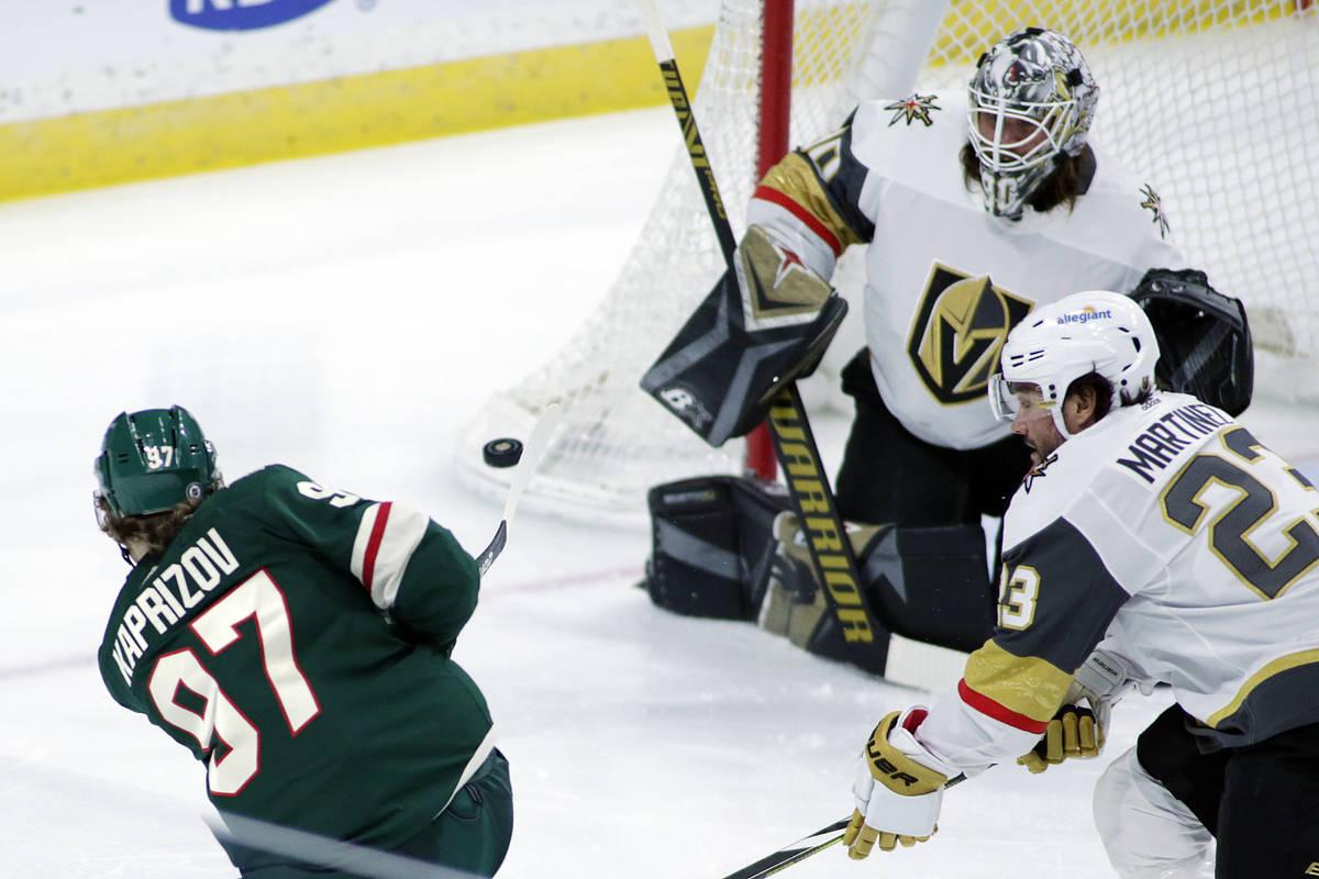 Minnesota Wild left wing Kirill Kaprizov (97) shoots on Vegas Golden Knights goaltender Robin L ...