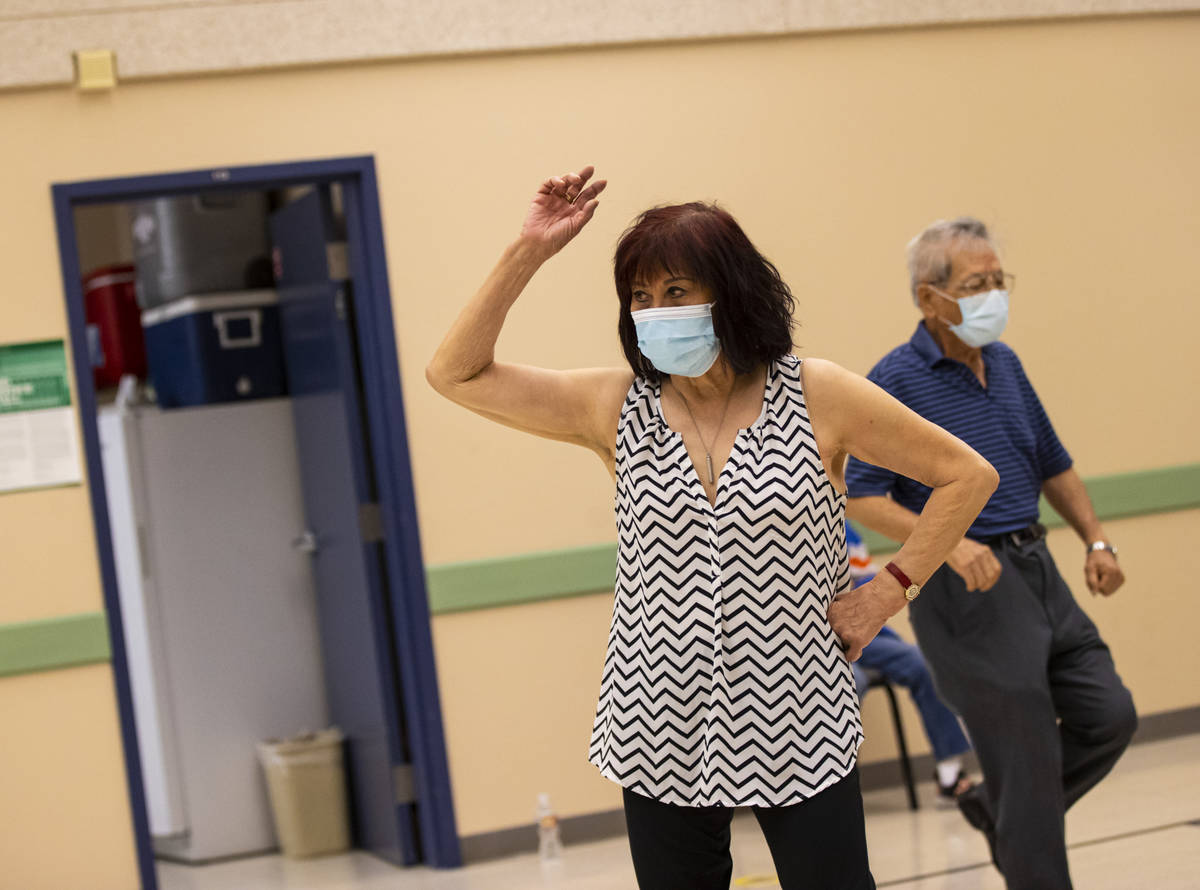 Terry Harris, 78, participates during a line dancing class at the West Flamingo Senior Center d ...