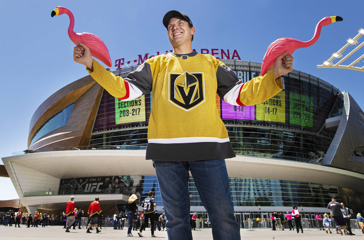 Drew Johnson holds plastic flamingo’s outside T-Mobile Arena on Saturday, May 8, 2021, i ...