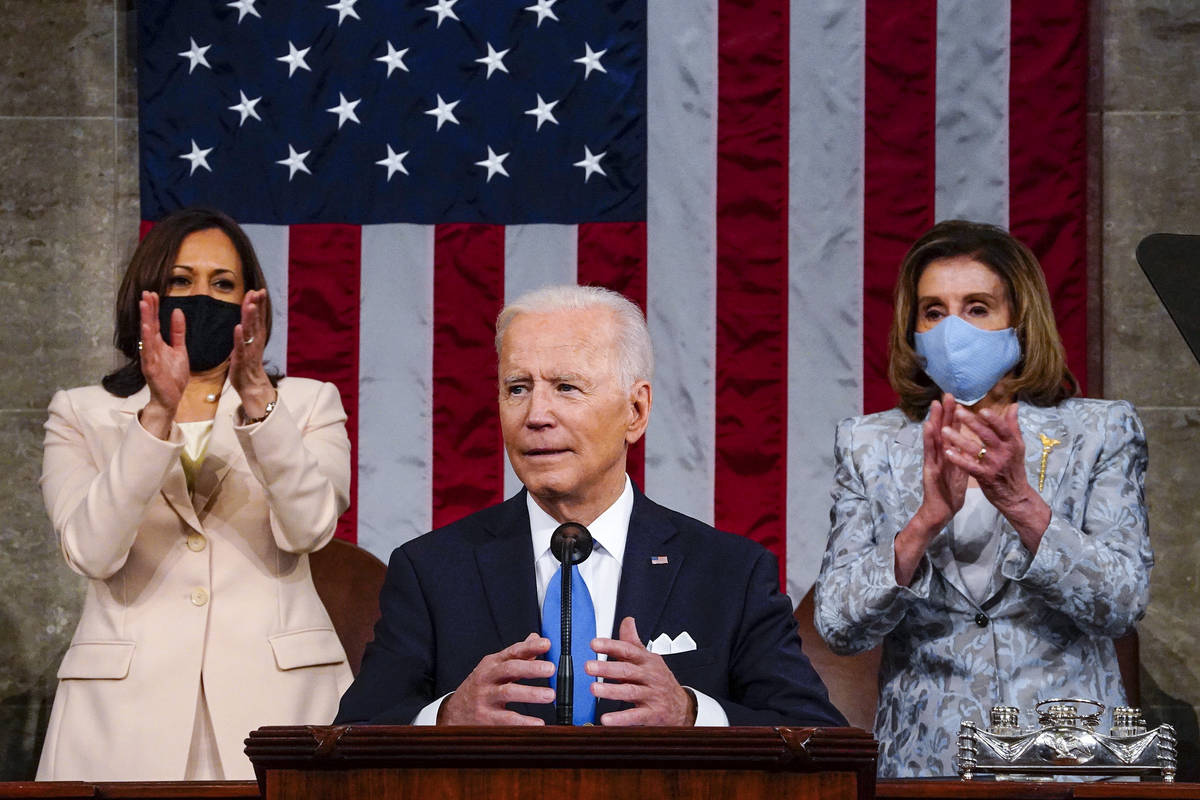 Vice President Kamala Harris and House Speaker Nancy Pelosi of Calif., stand and applaud as Pre ...