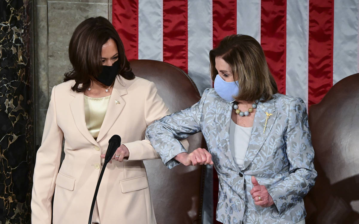 Vice President Kamala Harris, left, greets House Speaker Nancy Pelosi of Calif., ahead of Presi ...