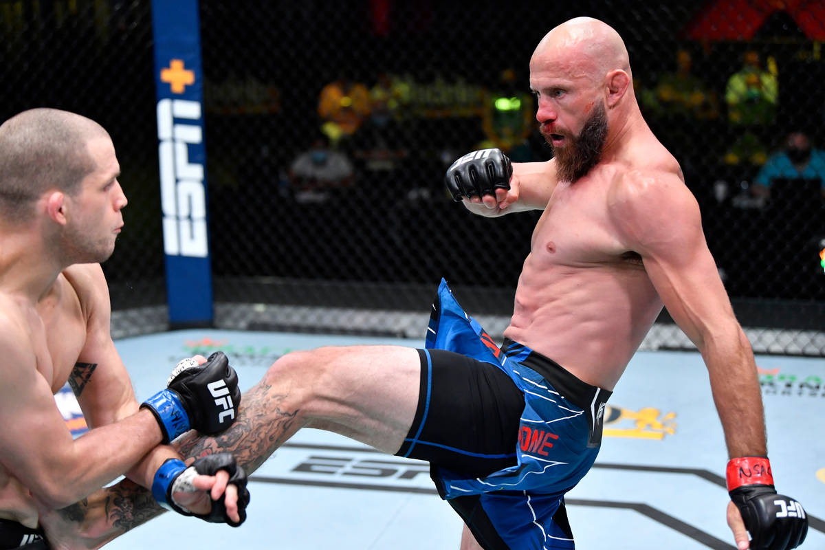 Donald 'Cowboy' Cerrone kicks Alex Morono in a welterweight fight during the UFC Fight Night ev ...