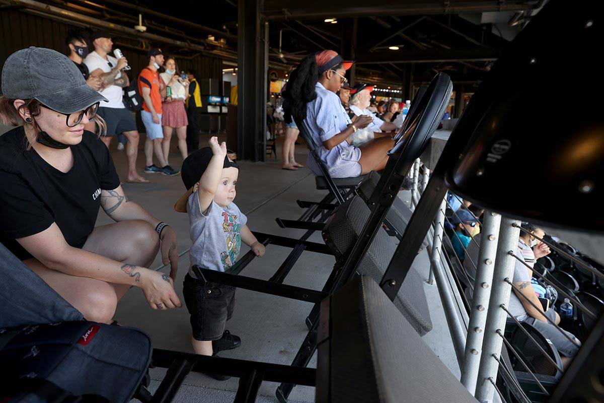 Mikayla Stevens and her son Maxtyn, 10 months, watch from the concourse at Las Vegas Ballpark b ...