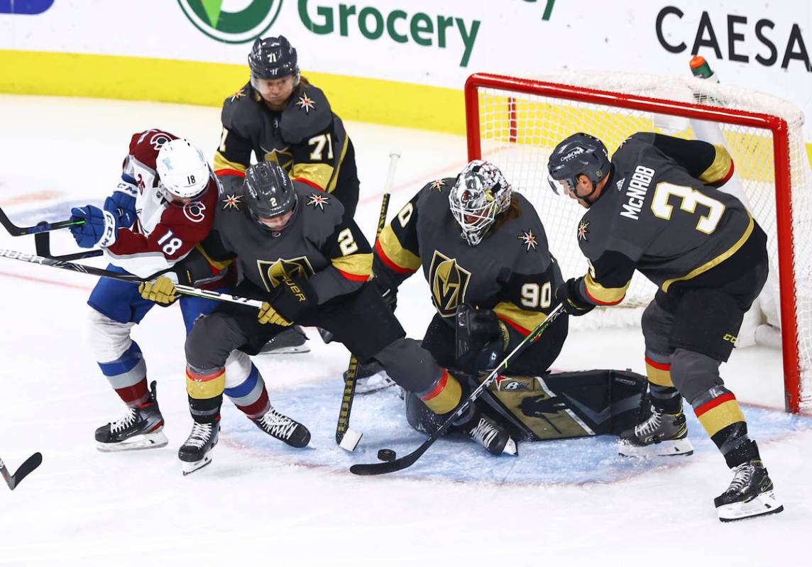 Golden Knights goaltender Robin Lehner (90) and defensemen Zach Whitecloud (2) and Brayden McNa ...