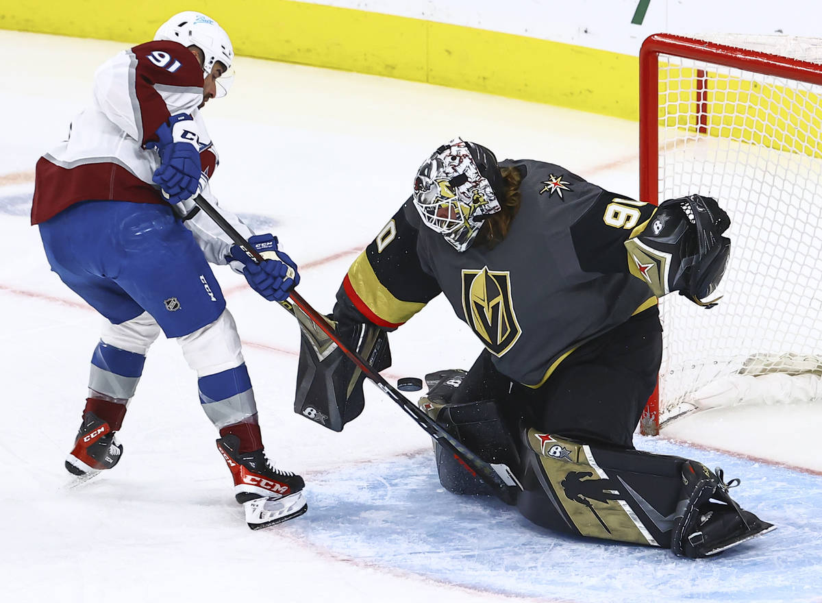 Golden Knights goaltender Robin Lehner (90) blocks the puck against Colorado Avalanche's Nazem ...