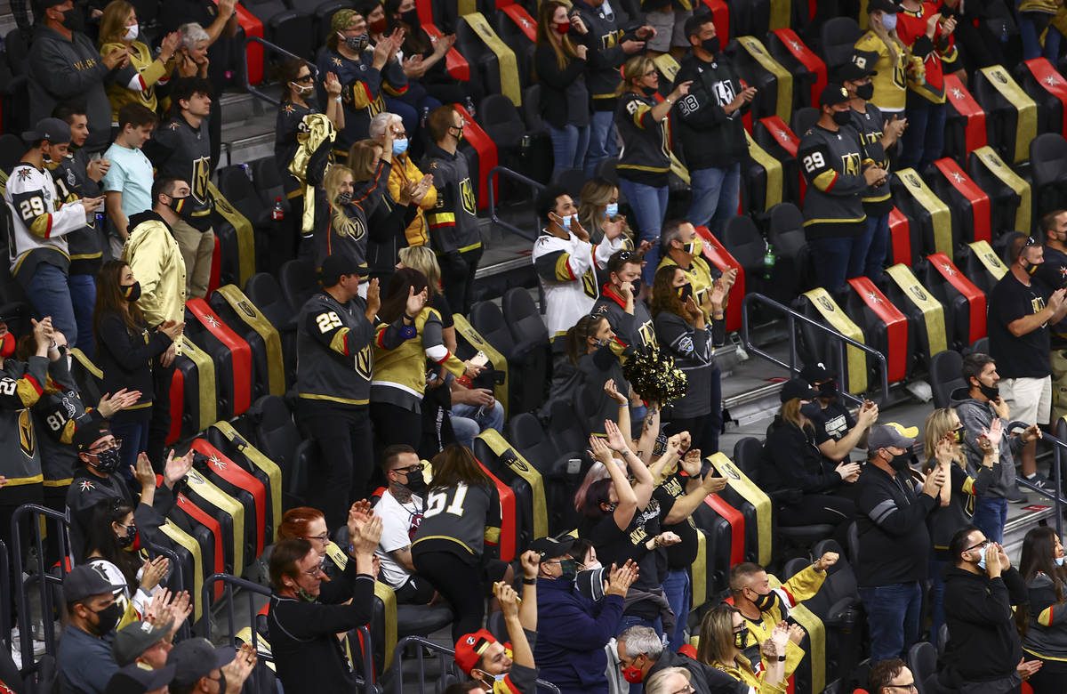 Golden Knights fans celebrate after a goal by defenseman Alex Pietrangelo, not pictured, durin ...