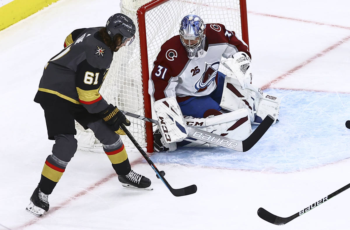 Golden Knights' Mark Stone (61) attempts a shot against Colorado Avalanche goaltender Philipp G ...