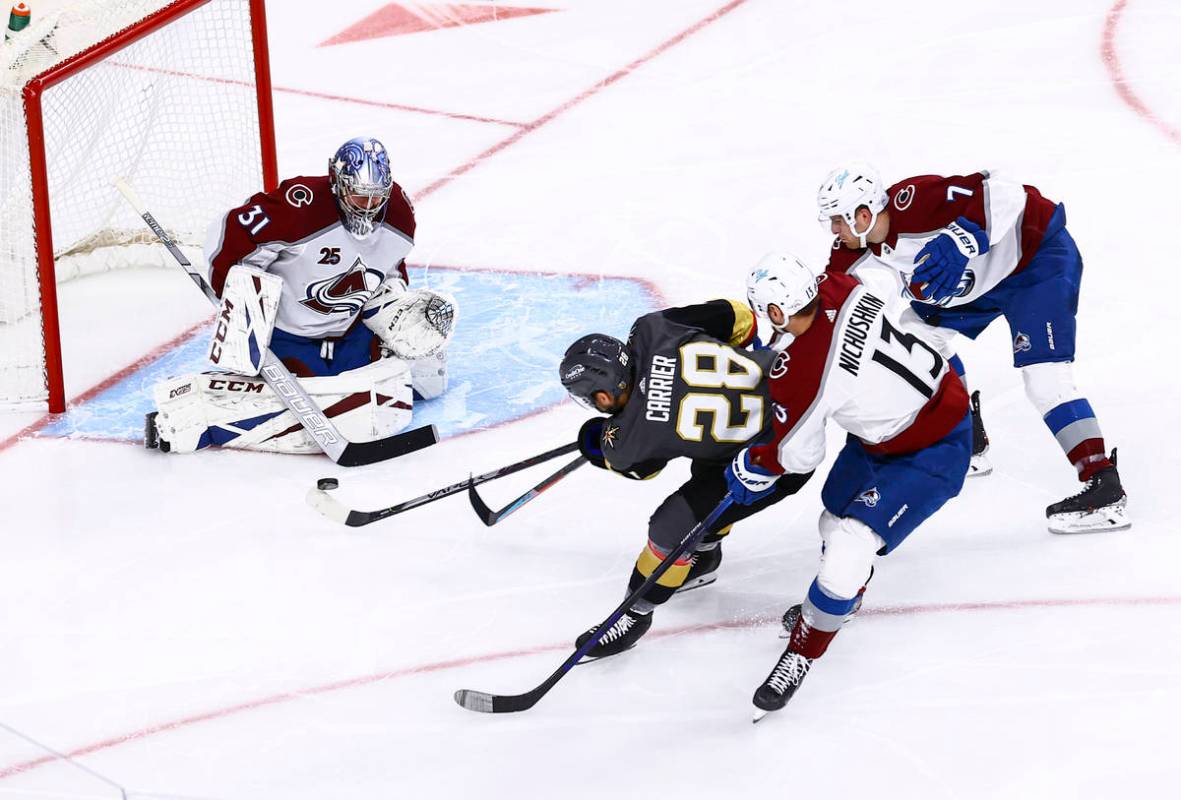 Colorado Avalanche goaltender Philipp Grubauer (31) makes a save against Golden Knights' Willia ...