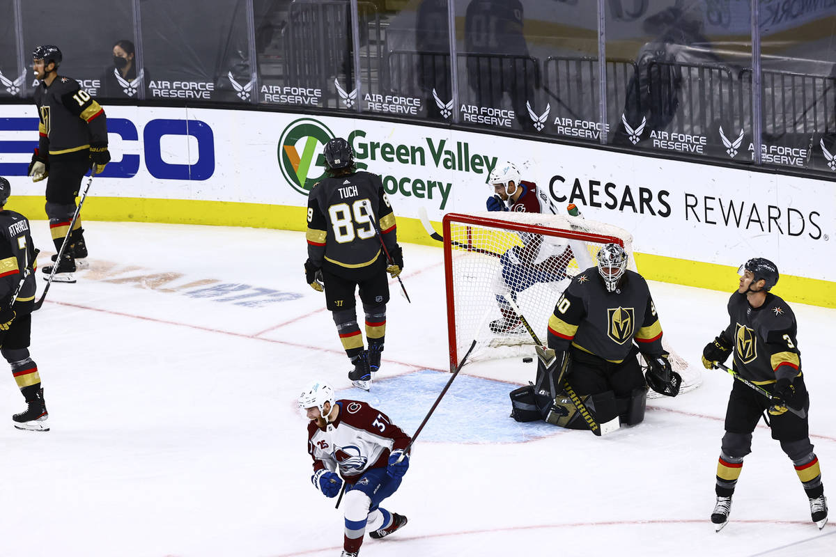 Colorado Avalanche's J.T. Compher (37) celebrates after scoring a goal past Golden Knights goal ...