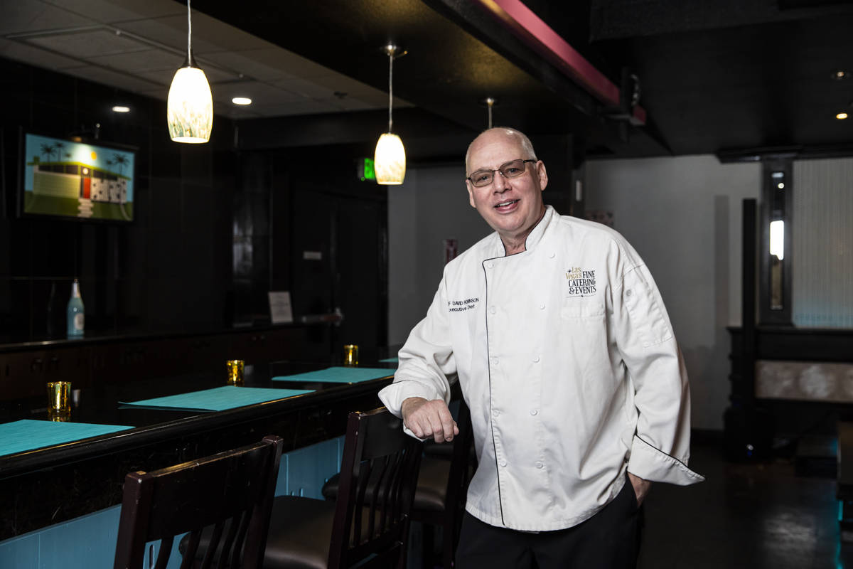 Chef David Robinson, owner of The Nevada Room, poses for a portrait at the venue at Commercial ...