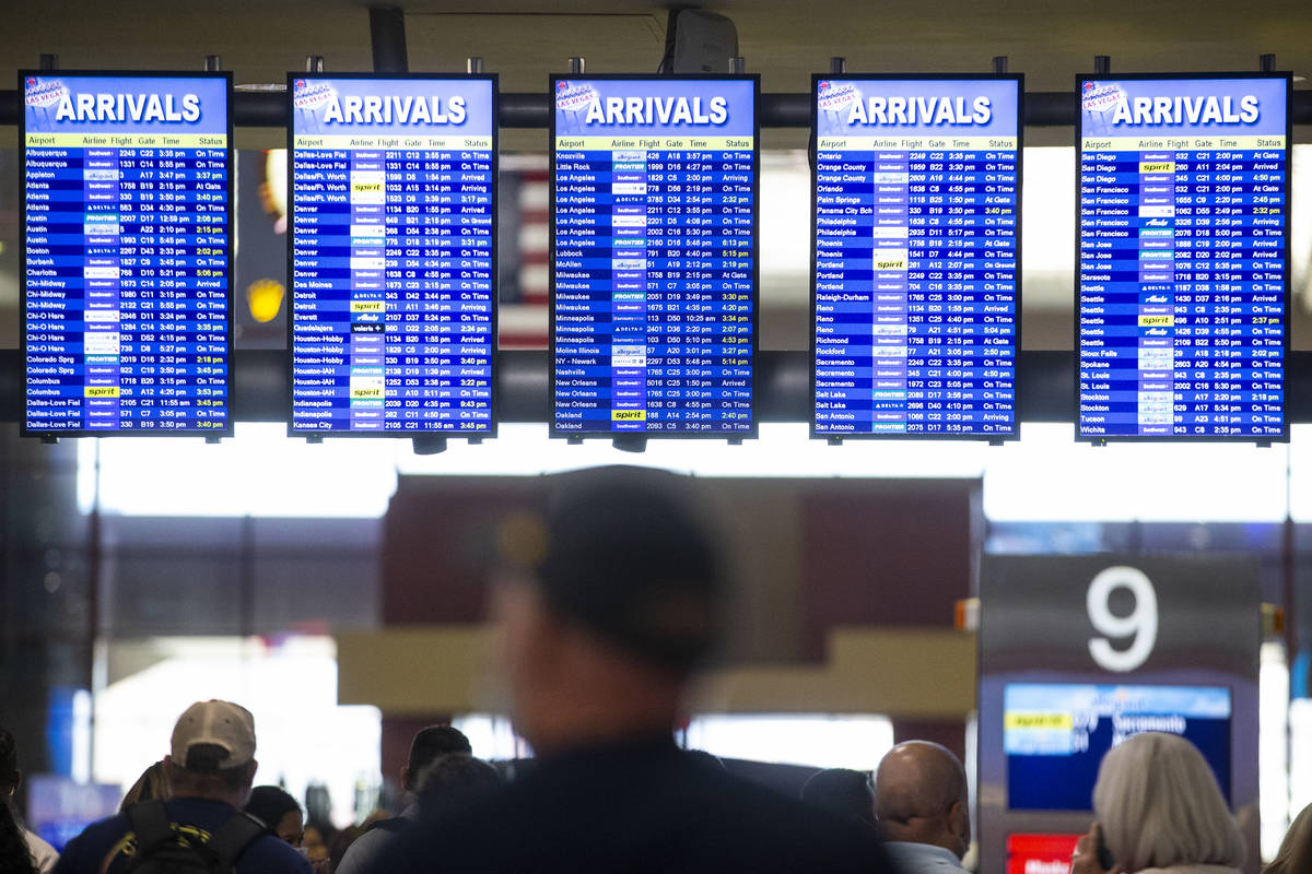 Screens show the arrivals times at McCarran International Airport Terminal 1 in Las Vegas, Thur ...