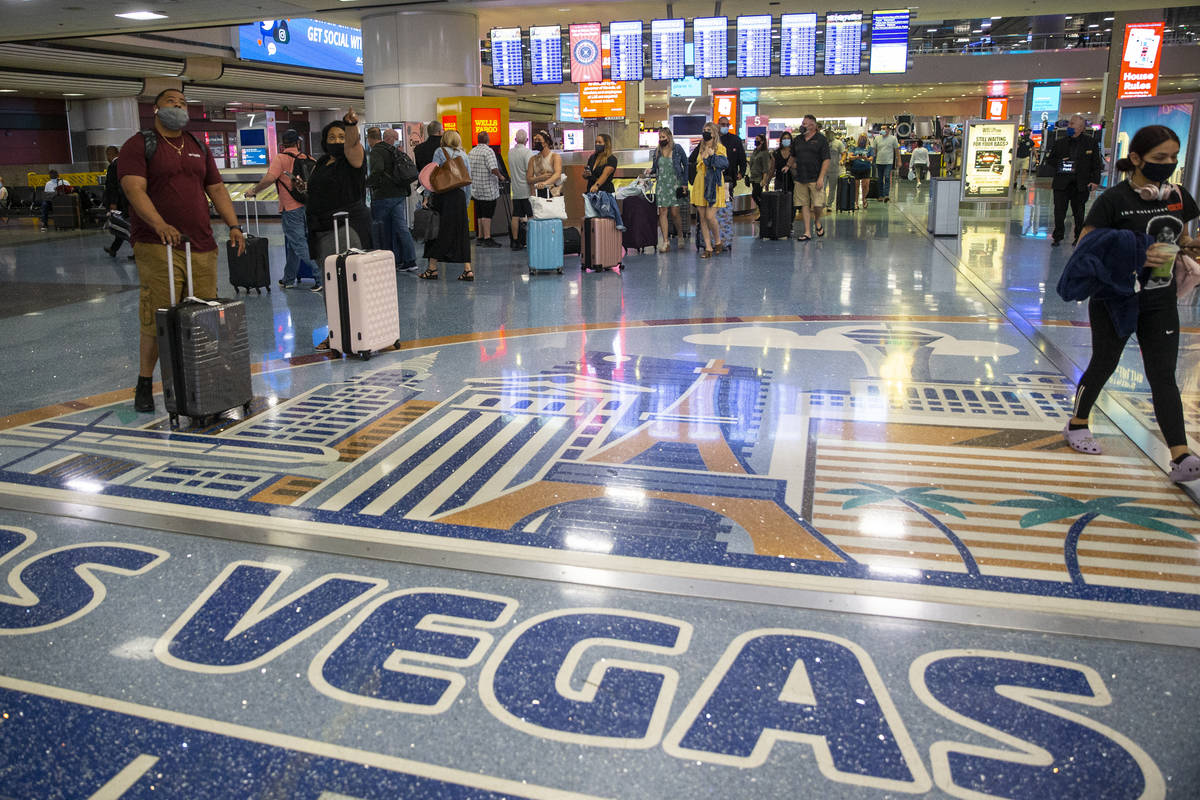 Travelers arrive to McCarran International Airport Terminal 1 in Las Vegas, Thursday, May 13, 2 ...