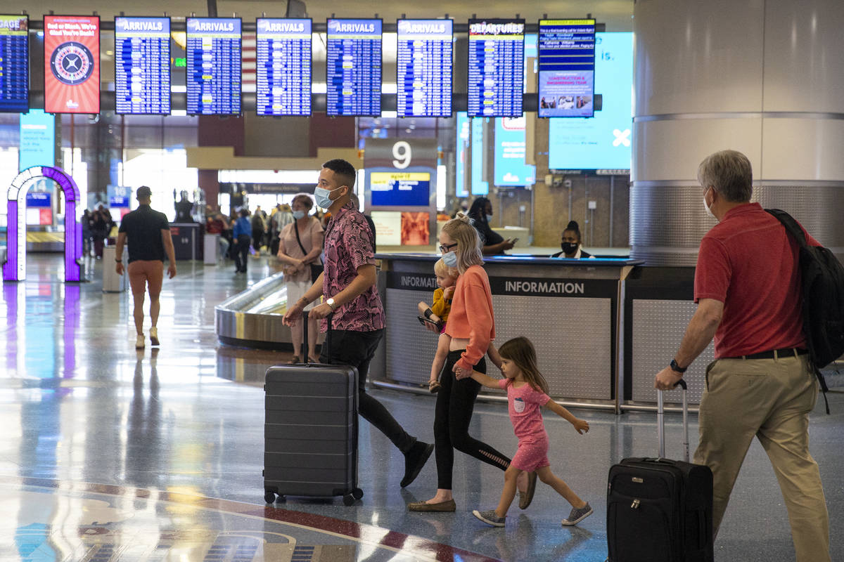 Travelers at McCarran International Airport Terminal 1 in Las Vegas, Thursday, May 13, 2021. (E ...