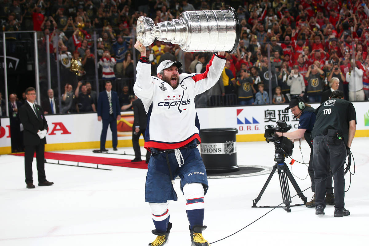 Washington Capitals left wing Alex Ovechkin (8) celebrates after defeating the Golden Knights i ...