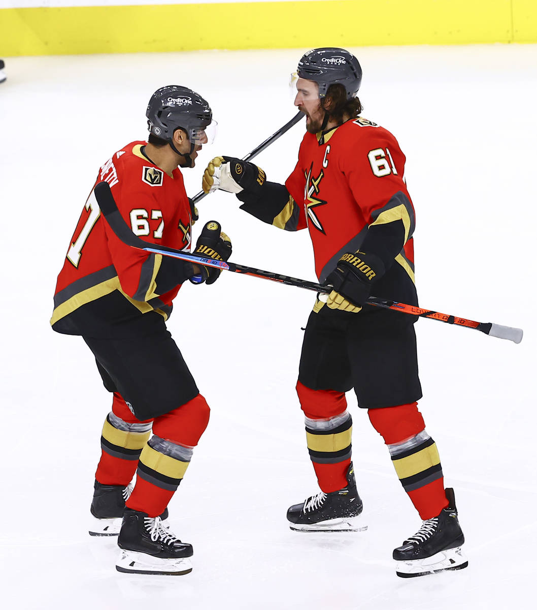Golden Knights' Mark Stone, right, celebrates his goal with Max Pacioretty during the third per ...