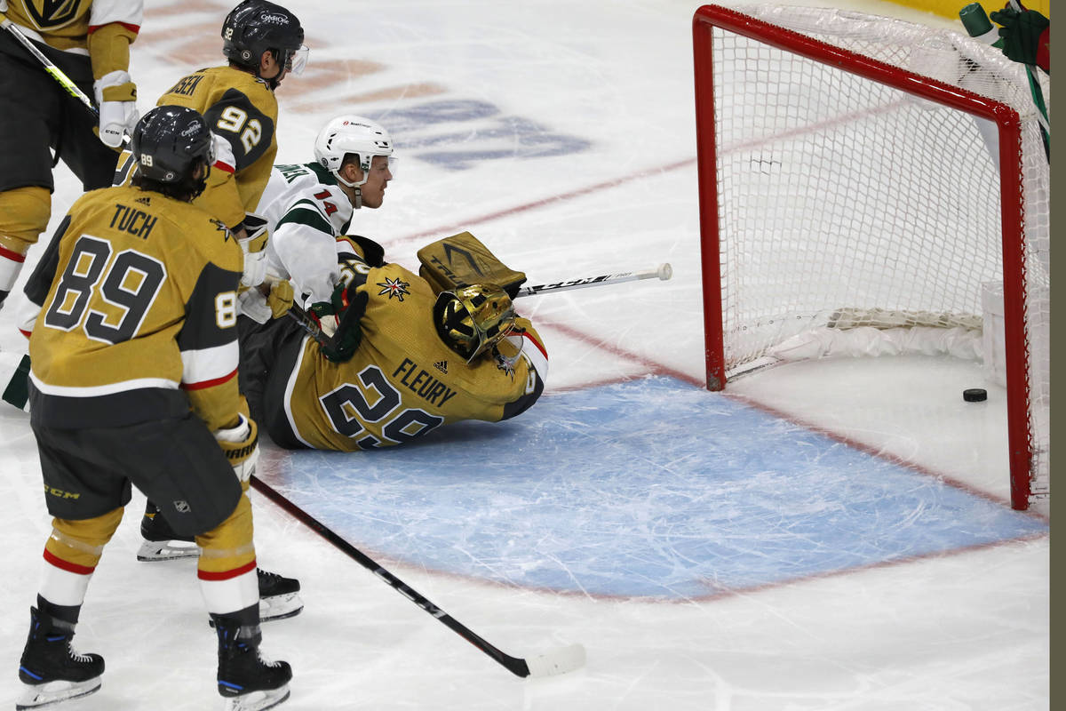 Minnesota Wild center Joel Eriksson Ek (14) scores against Vegas Golden Knights goaltender Marc ...