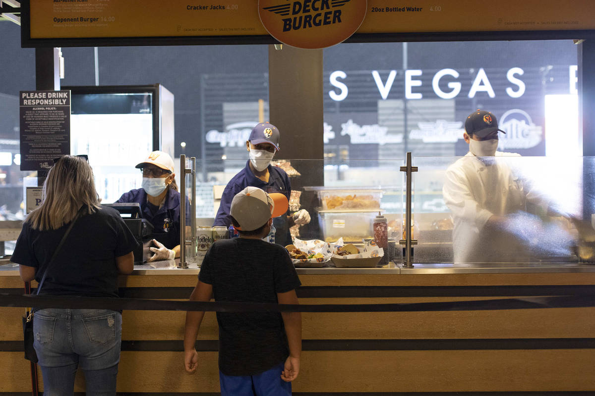Fans purchase burgers during a Las Vegas Aviators game against the Sacramento River Cats at Las ...