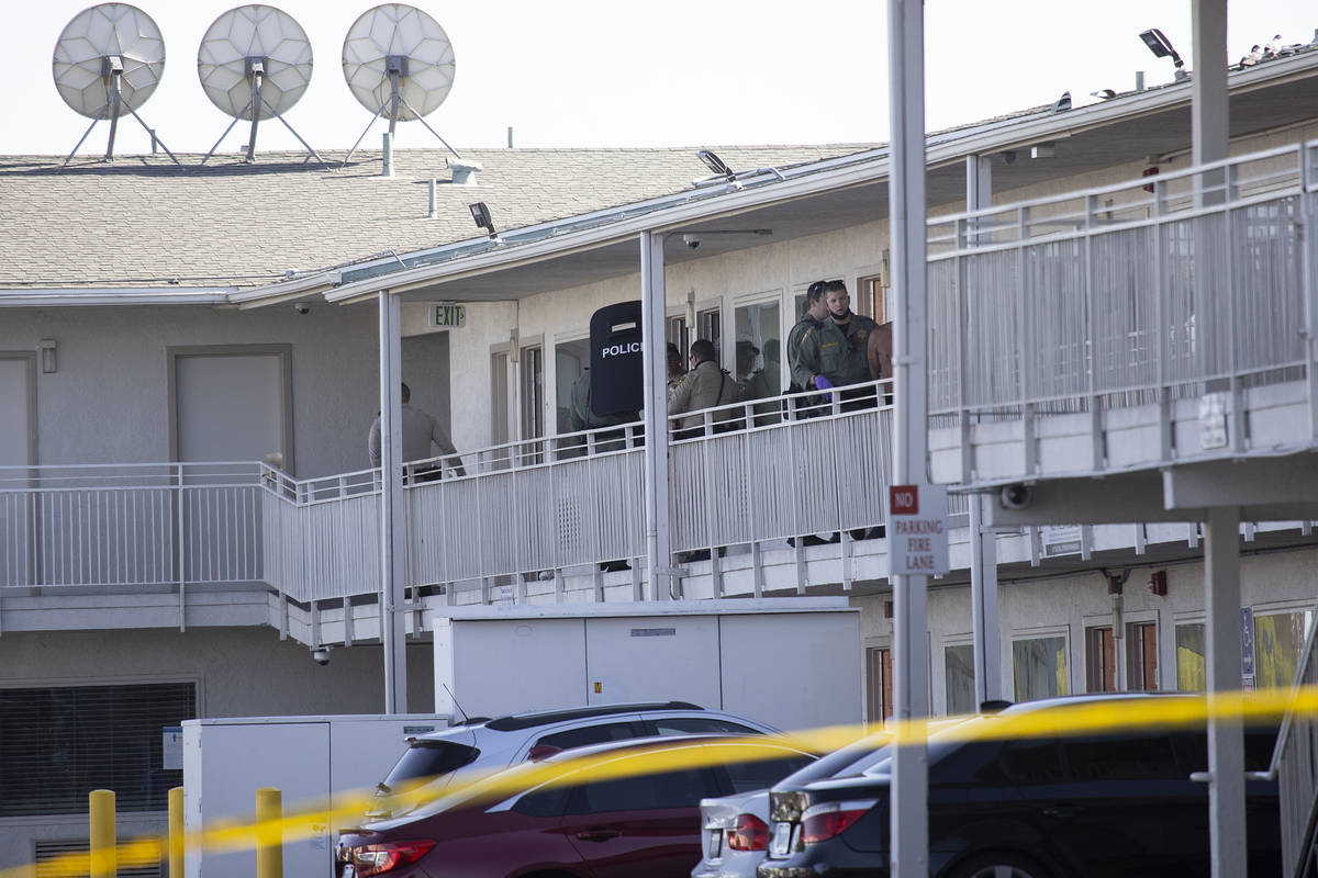 Police investigate the scene of a homicide at the Motel 6 near Koval Lane and Tropicana Avenue ...