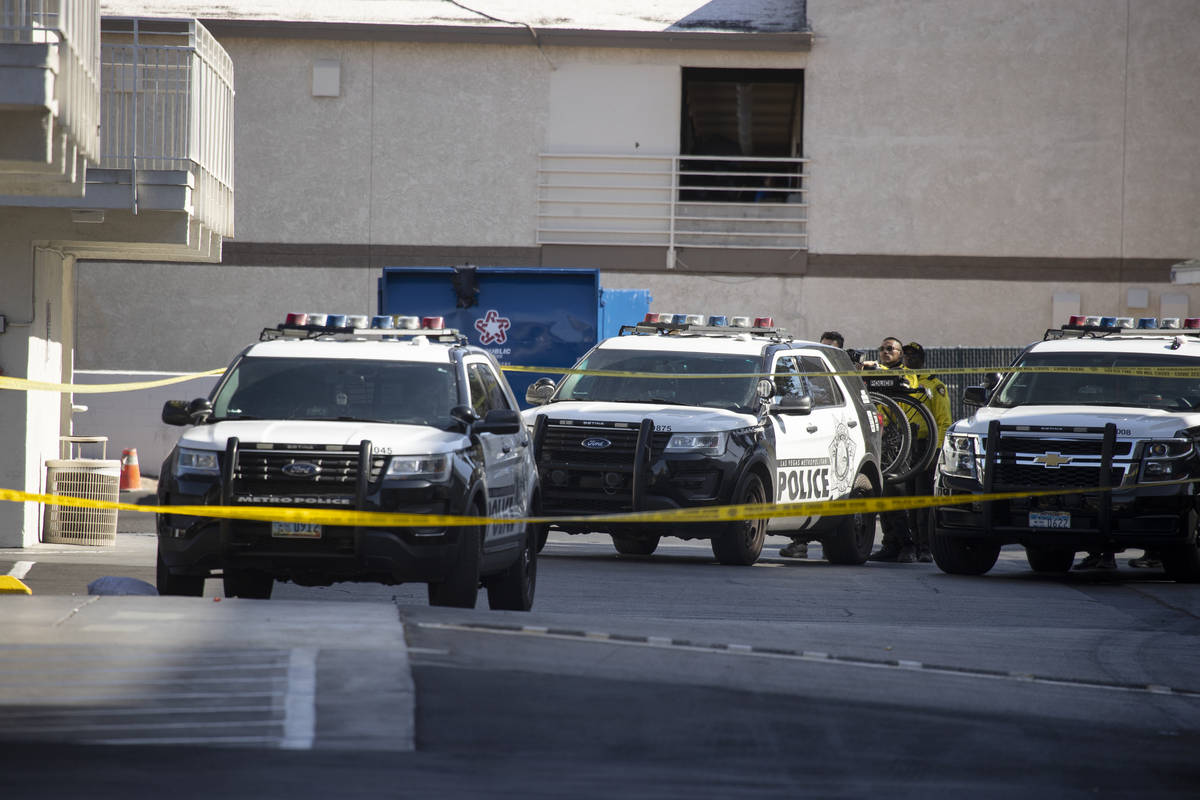 Police investigate the scene of a homicide at the Motel 6 near Koval Lane and Tropicana Avenue ...