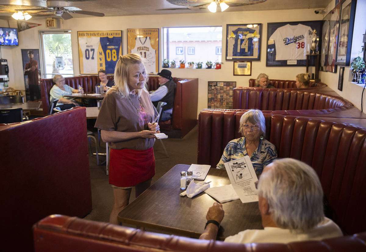 Waitress Kristin Perkins, left, takes a guests order during dinner at Sugar's Home Plate on Tue ...