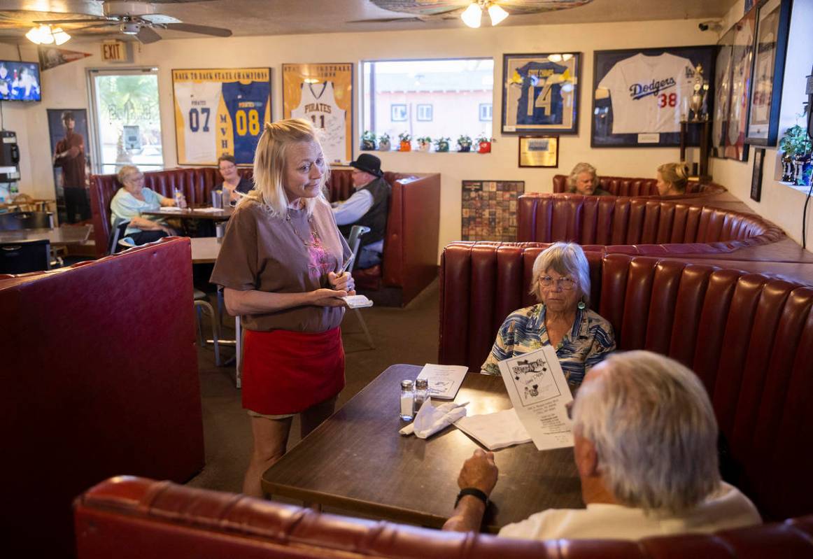 Waitress Kristin Perkins, left, takes a guests order during dinner at Sugar's Home Plate on Tue ...