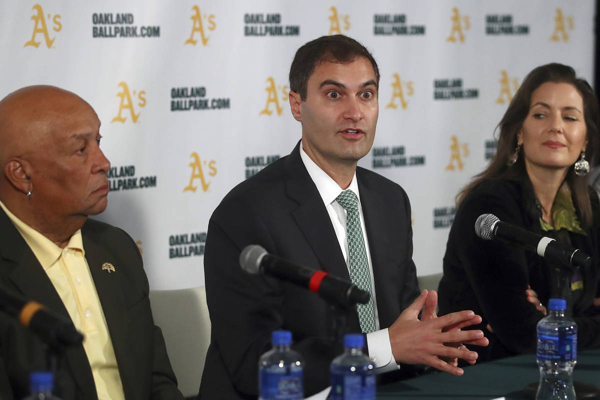 Oakland Athletics President Dave Kaval, center, speaks beside Oakland Mayor Libby Schaaf, right ...