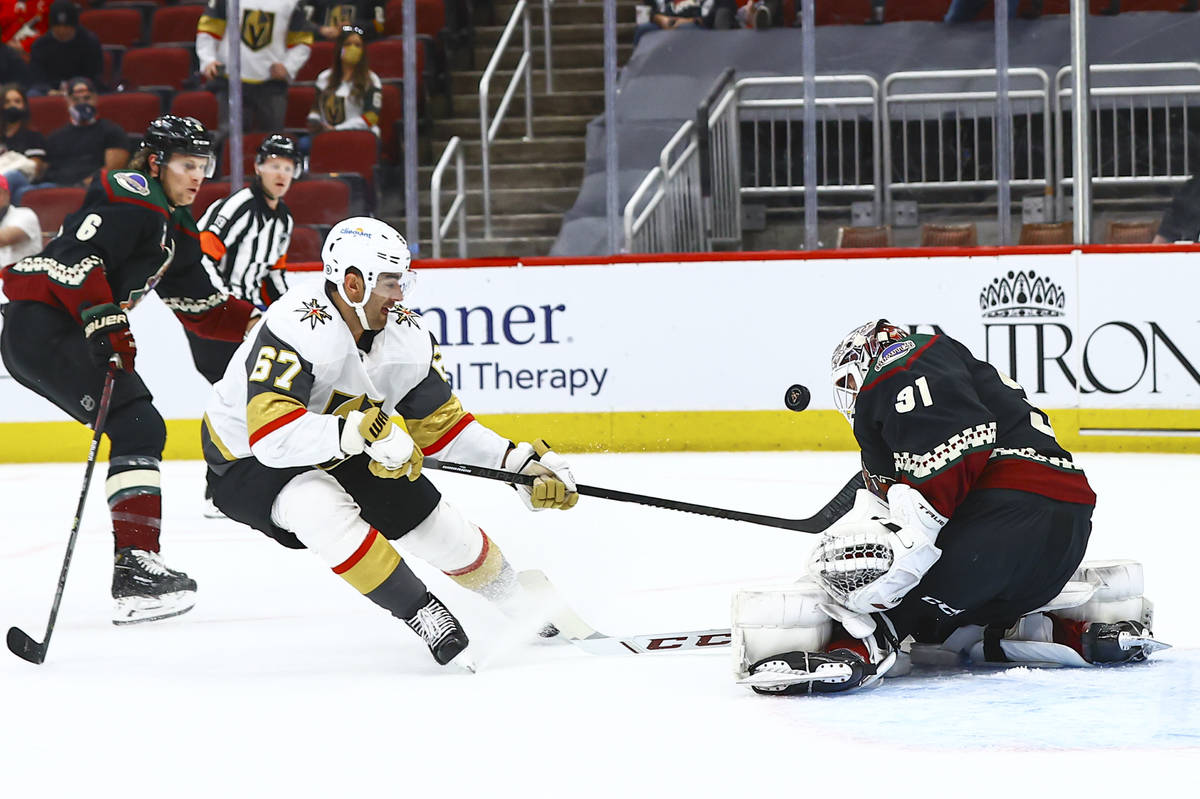 Arizona Coyotes goaltender Adin Hill (31) blocks a shot from Golden Knights' Max Pacioretty (67 ...