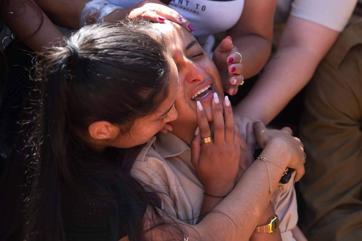 Friends and relatives of Israeli soldier Omer Tabib, 21, mourn during his funeral at the cemete ...