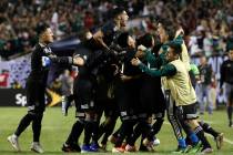 Mexico midfielder Jonathan Dos Santos (6) celebrates with teammates after scoring his first goa ...