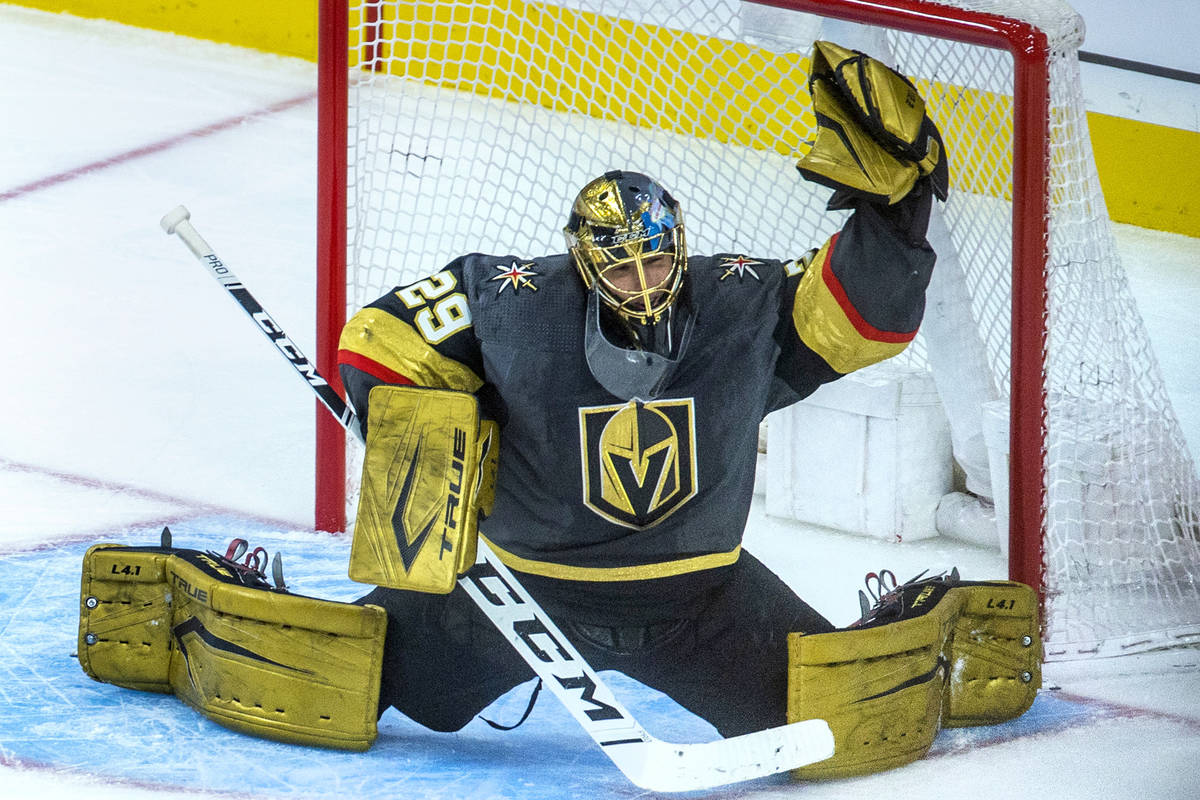 Golden Knights goaltender Marc-Andre Fleury (29) reaches up for another stop versus the Minneso ...