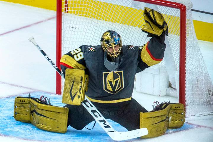 Golden Knights goaltender Marc-Andre Fleury (29) reaches up for another stop versus the Minneso ...