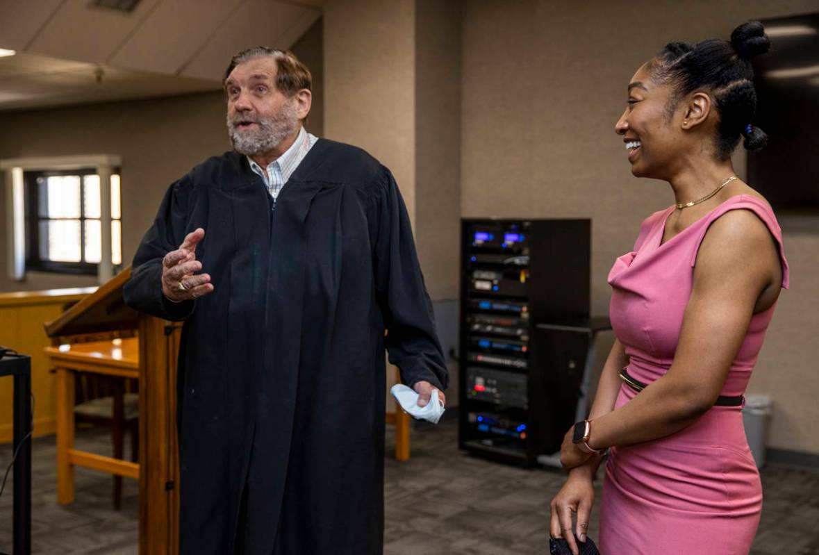Justice Michael Cherry, left, talks about his days in law school prior to a swearing in ceremon ...