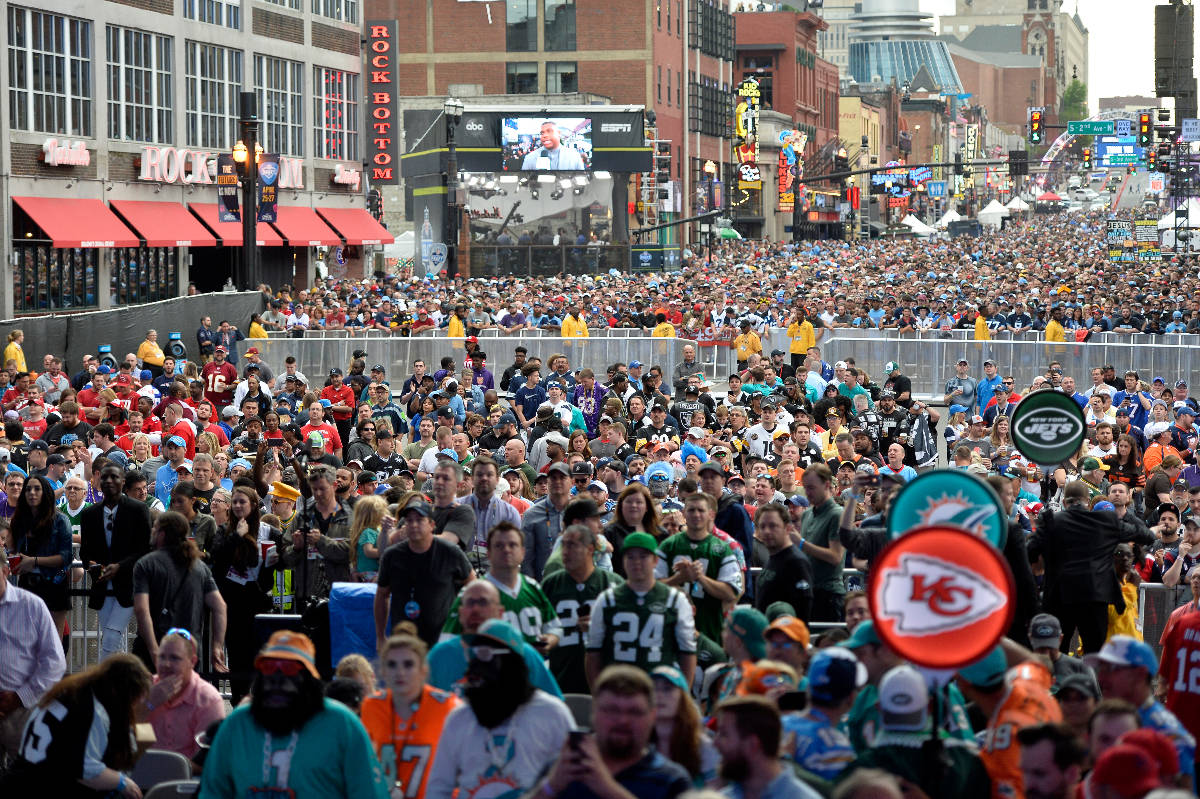 Fans crowd Broadway during the 2019 NFL Draft Thursday, Apr. 25, 2019, in Nashville, Tenn. (AP ...