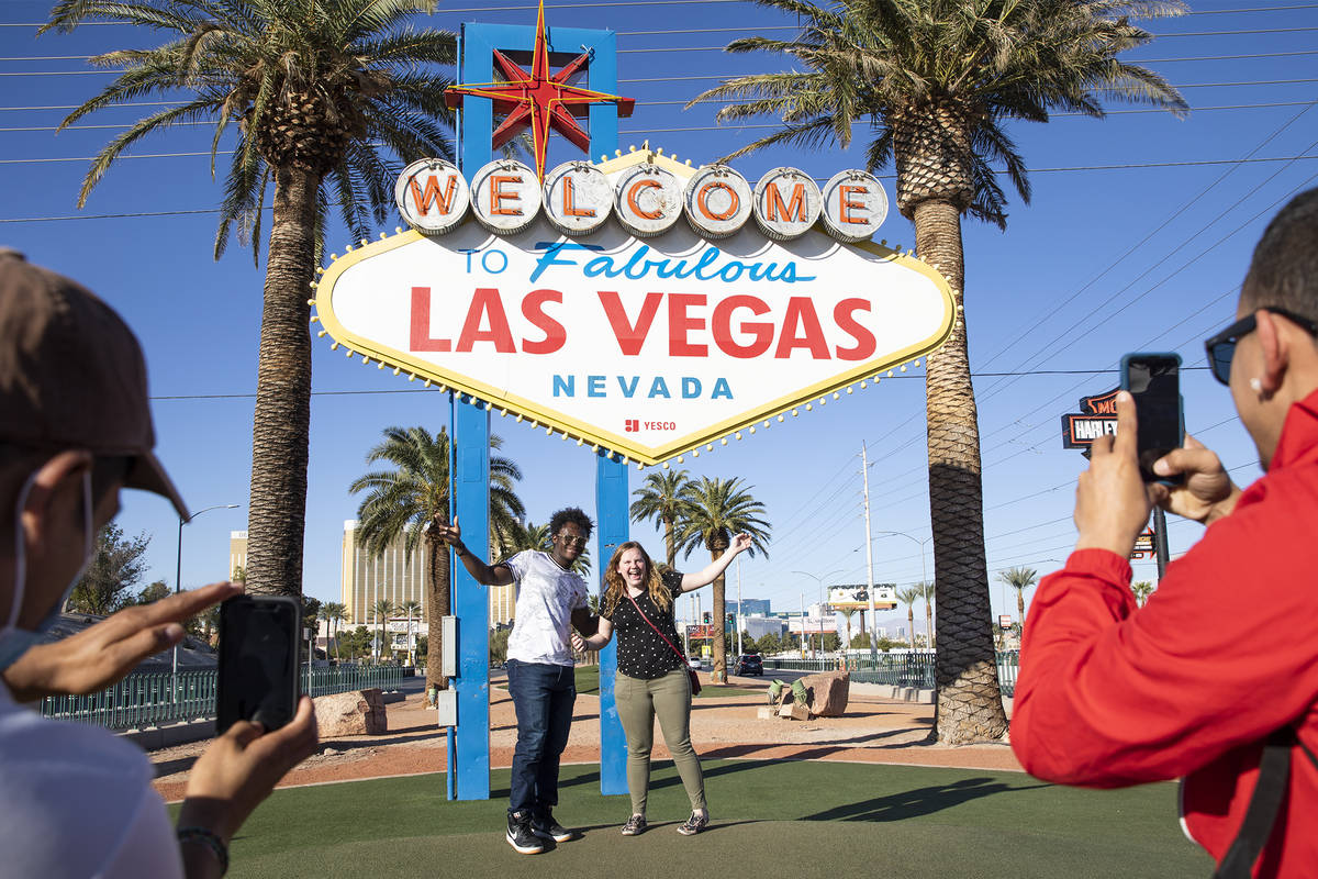 Nathan Mukubwa, left, and his girlfriend Melody Jacobsen, right, both of Colorado, pose for a p ...